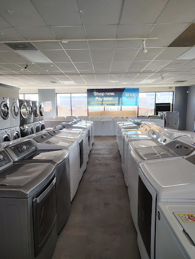 A laundry room with a lot of washers and dryers